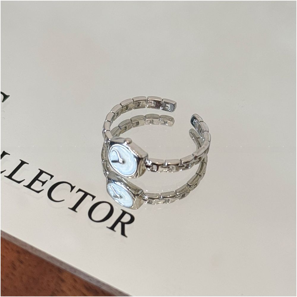 A reverse clock design a minimalist watch chain ring for women adjustable thin with a drop glaze finish for the index finger
