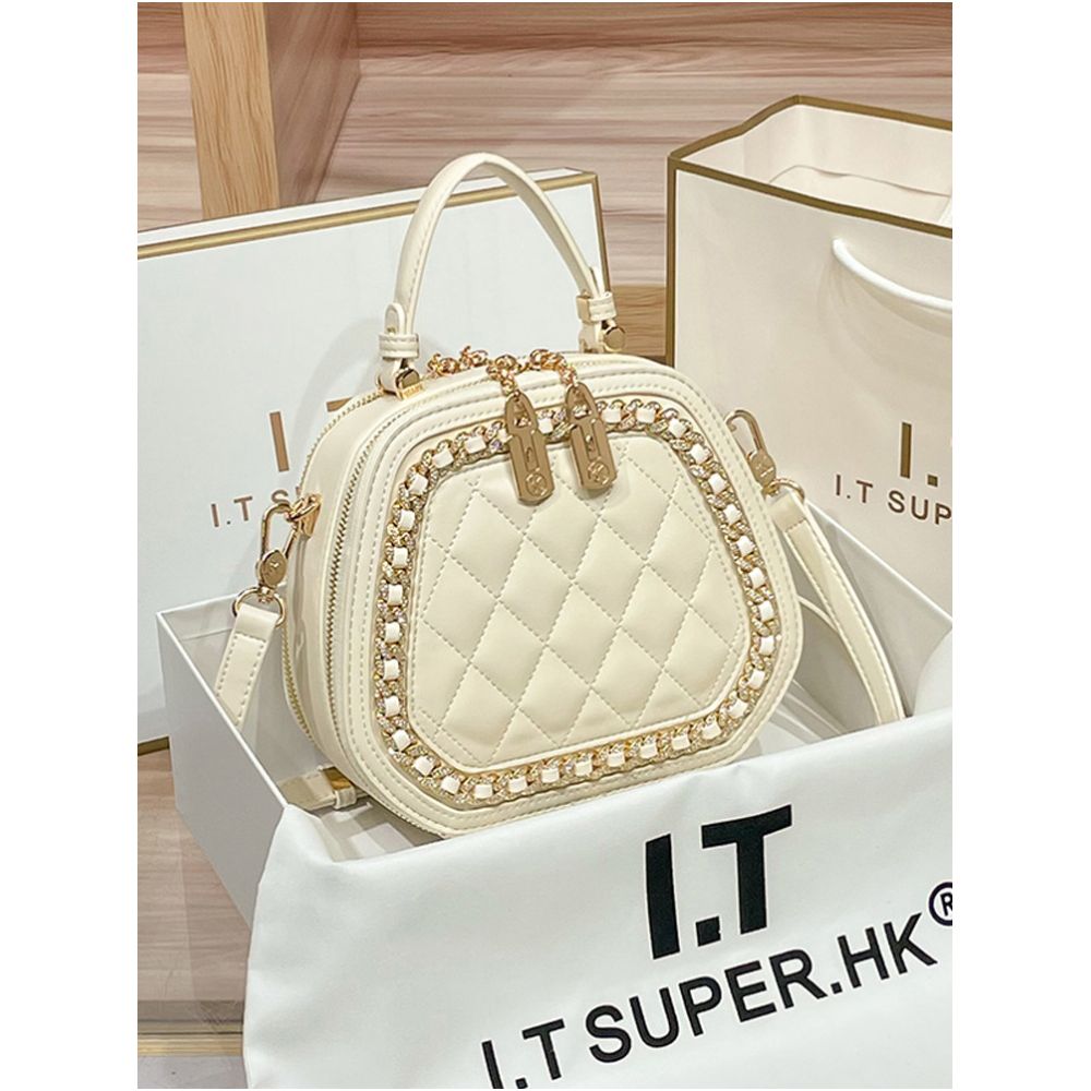 Hong Kong counter genuine leather bag women s 2025 new fashionable simple hand held small round bag high end single shoulder crossbody bag image 0