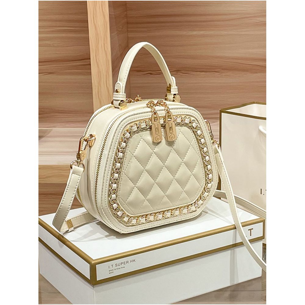 Hong Kong counter genuine leather bag women s 2025 new fashionable simple hand held small round bag high end single shoulder crossbody bag image 2