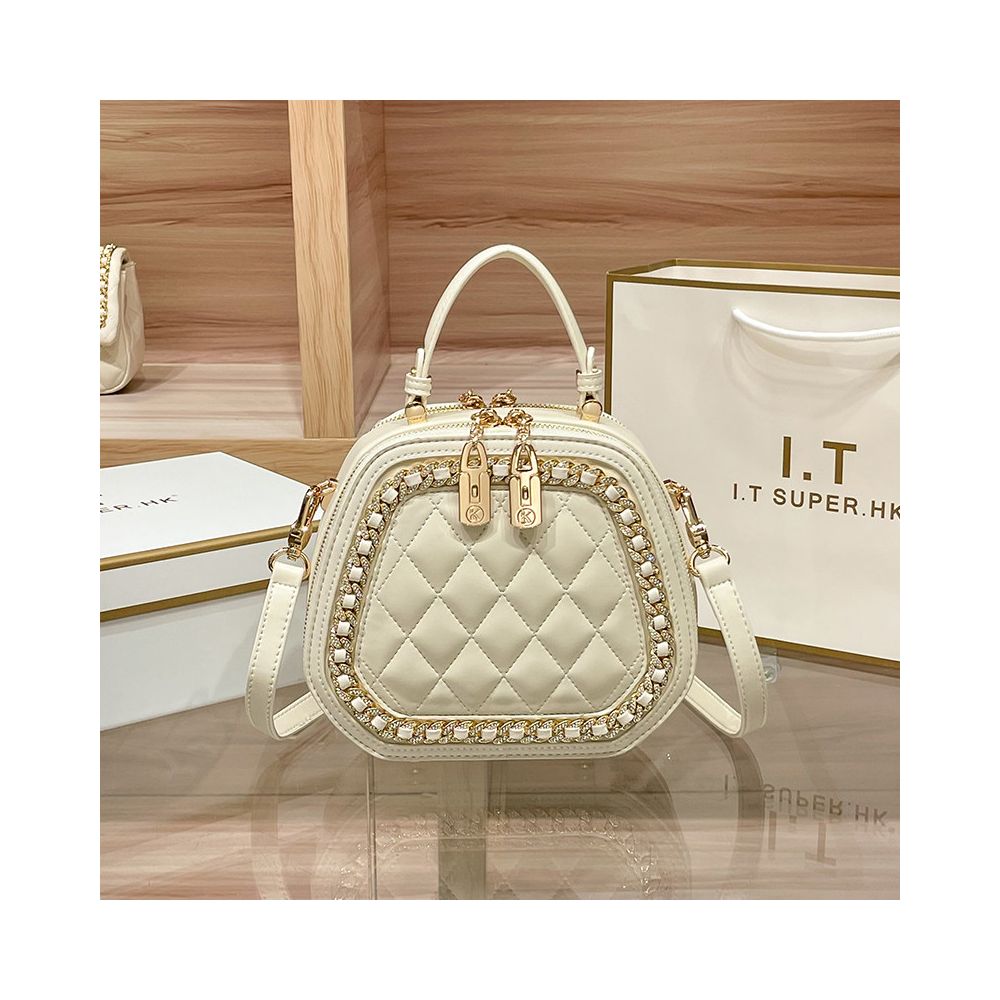 Hong Kong counter genuine leather bag women s 2025 new fashionable simple hand held small round bag high end single shoulder crossbody bag