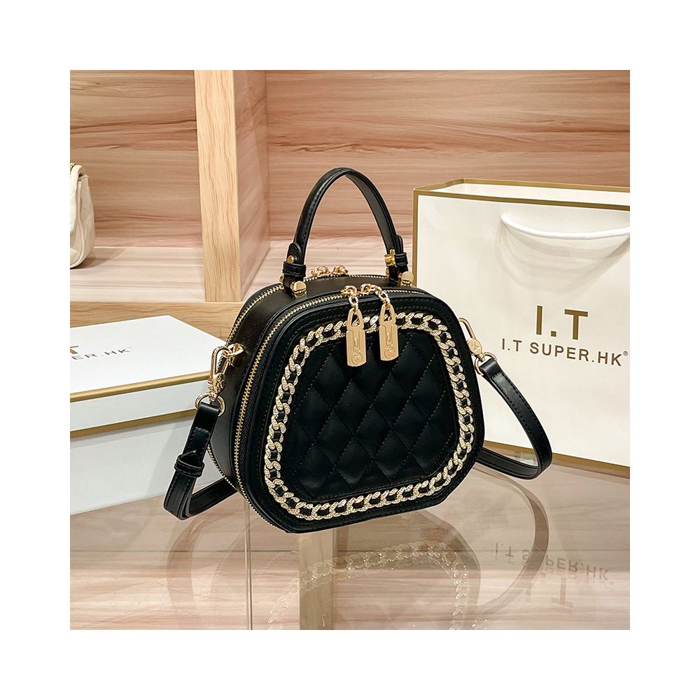 Hong Kong counter genuine leather bag women s 2025 new fashionable simple hand held small round bag high end single shoulder crossbody bag