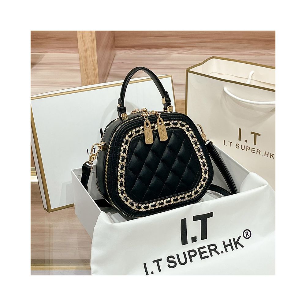 Hong Kong counter genuine leather bag women s 2025 new fashionable simple hand held small round bag high end single shoulder crossbody bag