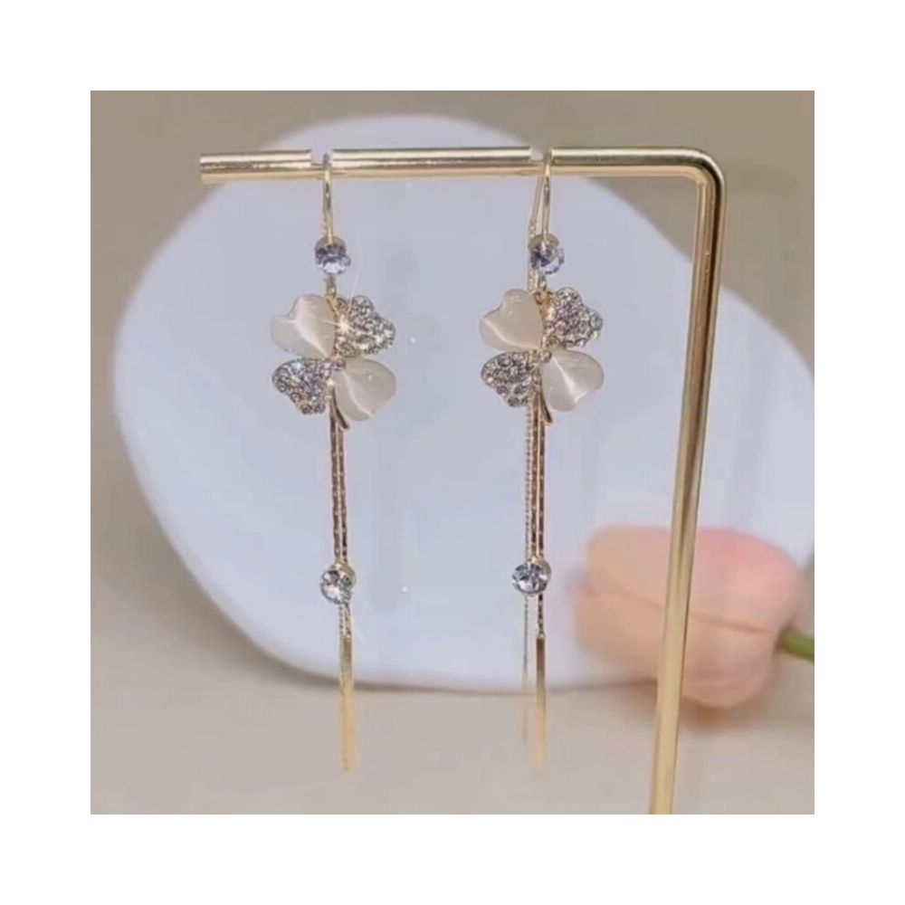 Light luxury temperament cat eye stone four leaf flower long tassel earrings round face slimming ear line 2026 new explosive earrings