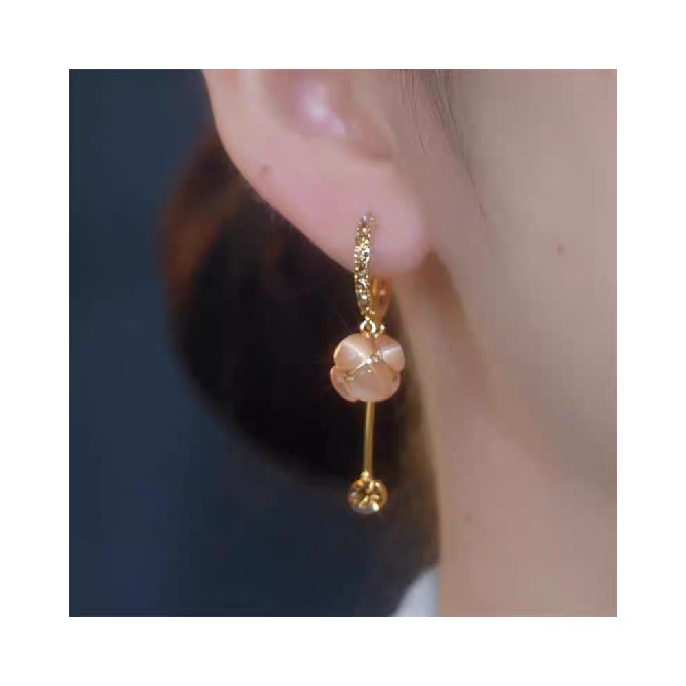 Spring and summer new cat eye stone ball tassel earrings for women with a high end feel micro inlaid ear buckles light luxury temperament face slimming earrings image 4