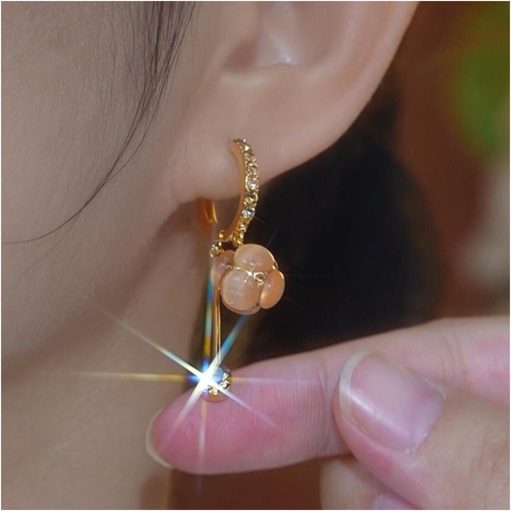 Spring and summer new cat eye stone ball tassel earrings for women with a high end feel micro inlaid ear buckles light luxury temperament face slimming earrings image 5
