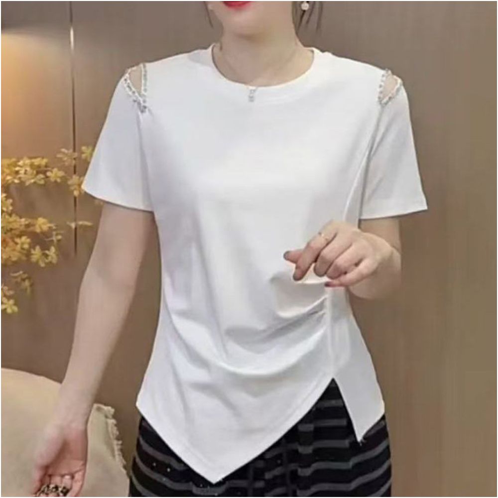This stylish new summer T shirt features a unique design with hollowed out beading details making it a youthful and flattering base layer It s also a versatile and slimming option
