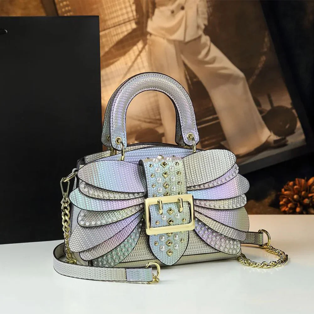 2025 new riveted wing hand-held women's bag, colorful chain crossbody single-shoulder dinner buns mother bag