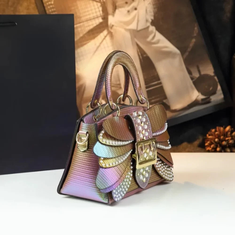 2025 new riveted wing hand-held women's bag, colorful chain crossbody single-shoulder dinner buns mother bag