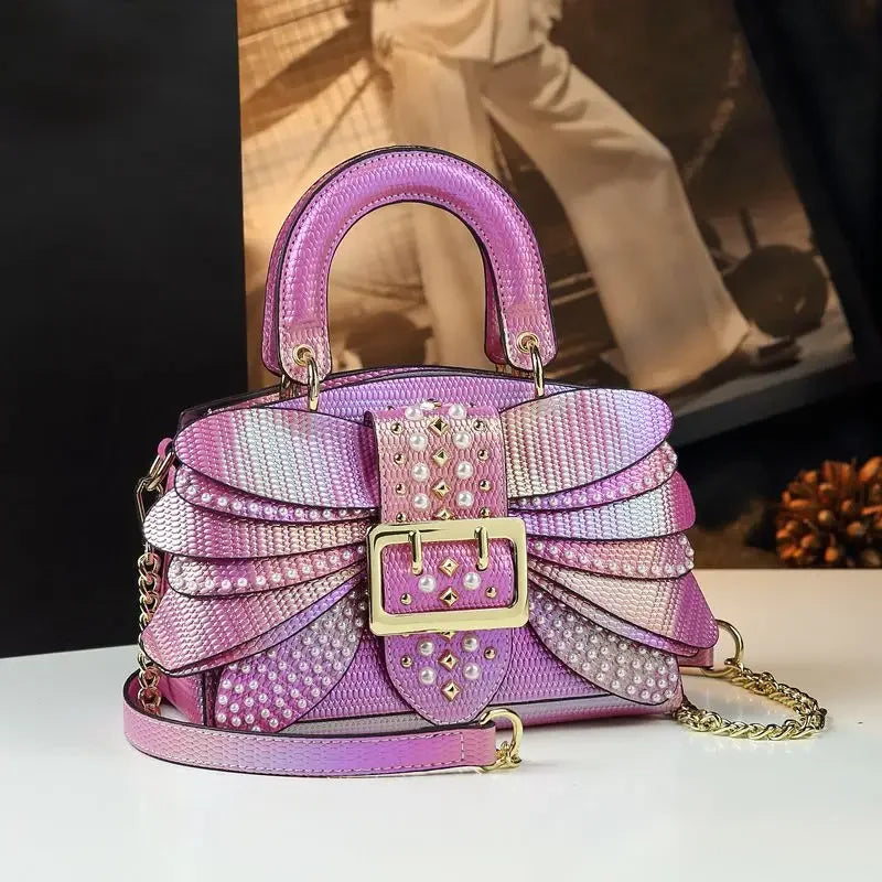 2025 new riveted wing hand-held women's bag, colorful chain crossbody single-shoulder dinner buns mother bag