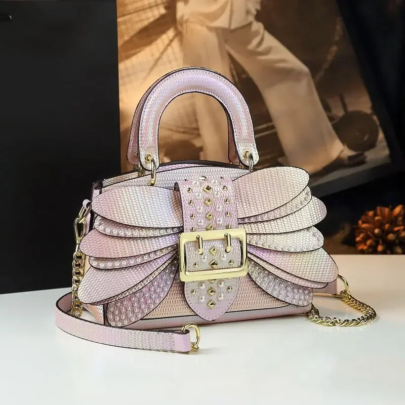 2025 new riveted wing hand-held women's bag, colorful chain crossbody single-shoulder dinner buns mother bag
